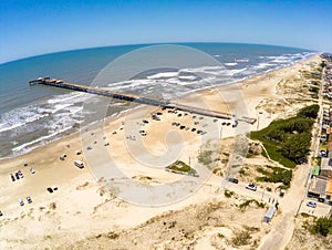 Fishermen pier, sand and waves