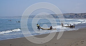 Fishermen on reed boats, Huanchaco,Peru