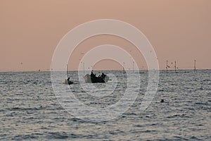 fishermen returning from their fishing nets