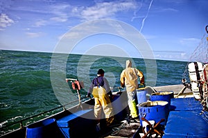 Fishermen in rough sea