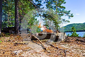 Fishermen`s camp on the island with a bonfire. Lake Tagasuk. Krasnoyarsk, Siberia, Russia