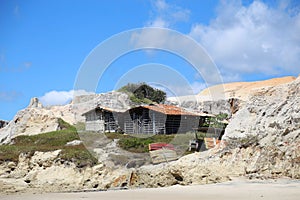 Fishermen`s huts housed on the cliff of Morro Branco, state of CearÃ¡, Brazil.