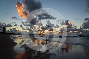 Fishermen are seen fishing during dawn on Jaguaribe beach in the city of Salvador, Bahia