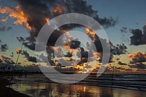 Fishermen are seen fishing during dawn on Jaguaribe beach in the city of Salvador, Bahia