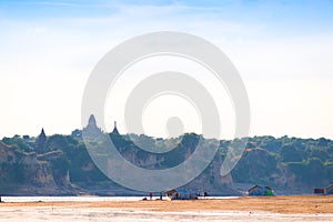 Fishermen on the shore of the Irrawaddy river, Mandalay, Myanmar, Burma. Copy space for text.