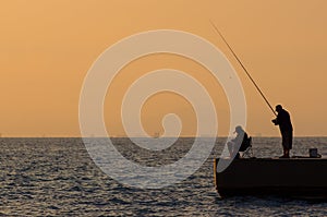 Fishermen at sunset