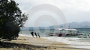 Fishermen in the super typhoon Ketsama in Puerto Princesa, Palawan, Philippines