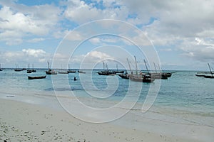 Fishermen with their fishing boats in Jambiani, Zanzibar photo