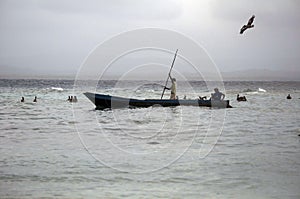 Fishermen in tropical water