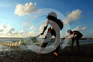 Fishermen working at the beach