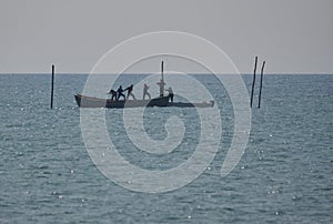 Fishermen working in a boat at Black Sea