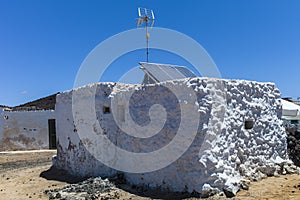Fishermenâ€™s hut with antenna and solar panels.