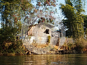 A fishers house at the river in burma