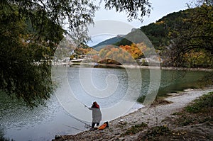 The fisherwoman by the lake near the Crimean Mangup-Kale mountain