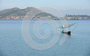 Fisherwoman with net at loktak lake