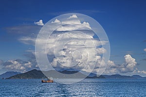 Fishery boat and blue sky white cloud koh chang trad thailand photo