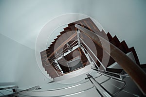 Fisheye lens view of an interior wooden stairway in home