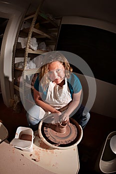 Fisheye shot of potter shaping clay