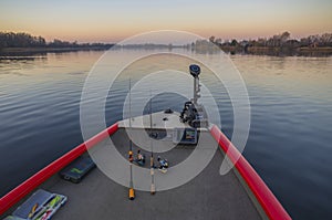 Fishfinder, echolot, fishing sonar at the boat with fishing tackles photo