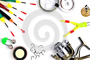 Fishing accessories, accessory box, fishing reel, hooks, fishing line, floats on a white background, a place for copy space