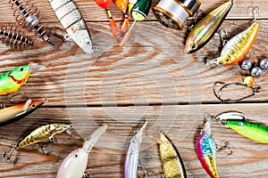 Fishing accessories on a wooden background.