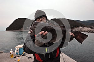 Fishing angler Asian sheepshead wrasse in Japan.