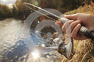 Fishing at autumn river