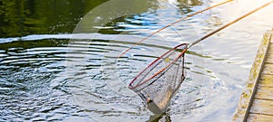 Fishing background - trout in casher and angel am see with wooden pier