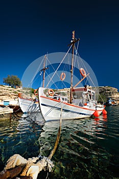 Fishing boars in harbour in fishing village of Mandrakia, Milos island, Greece