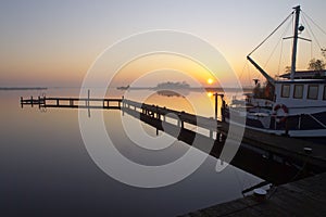 Fishing boat along a jetty