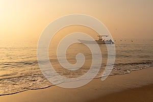 Fishing boat anchored close to shore