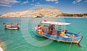 Fishing boat anchored in Matala bay, Crete