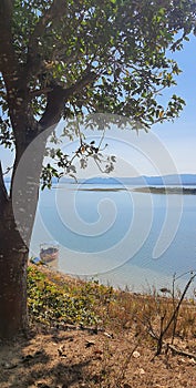 Fishing boat anchored at shore in Kaptai lake Hill tracts of Chittagong