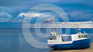 Fishing boat on a Baltic Sea coast in Mechelinki, Poland photo