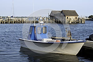 fishing boat in bay harbor marina Montauk New York USA the Hamptons photo