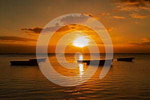 Fishing boats at sunset on the Public beach of Albion in the west of the republic of Mauritius. photo