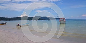 Fishing boat on the beach and in the bay of Koh Rong Samloem, tropical ocean, paradise