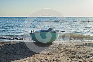 Fishing boat on the beach . Boat with oars