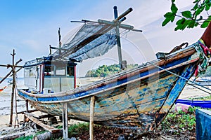 Fishing boat on beach for repairs, Phuket, Thailand
