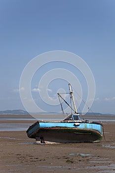 Fishing boat and beach scene