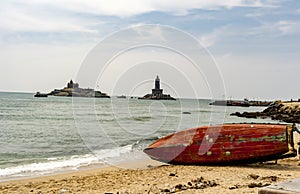 A fishing boat being set upright, by fishermen