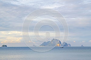 Fishing boat in blue sea and cloudy sky