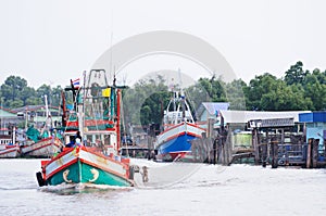 Fishing boat in brackish water canel connect to the sea.