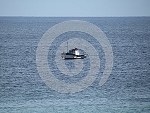 Fishing boat. Calm sea, cold water, suitable for squid fishing .
