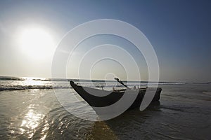 Fishing boat on candolim beach, Goa, India. photo