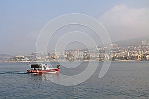 Fishing Boat With the city of Kusadasi, Turkey in the Background