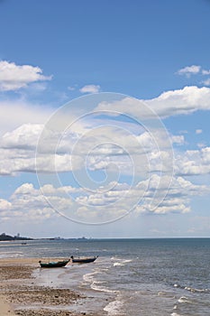 Fishing boat in the cloundy sea