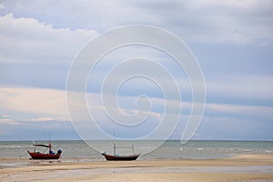 Fishing boat in the cloundy sea