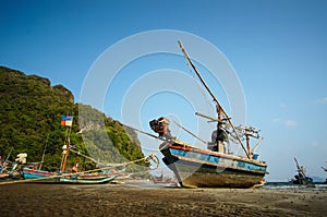 Fishing boat docking on the beach