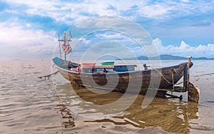 Fishing boat docking on the sand bars in morning sunrise